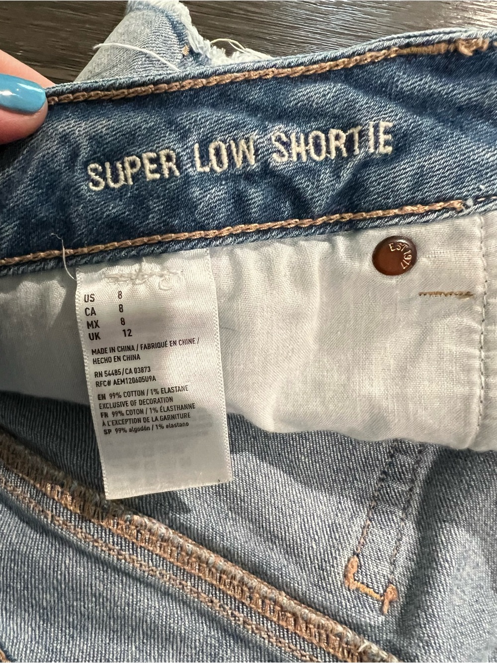 American Eagle Outfitters Light Wash Distressed Denim Shorts with Lace Panels - Picture 3 of 4